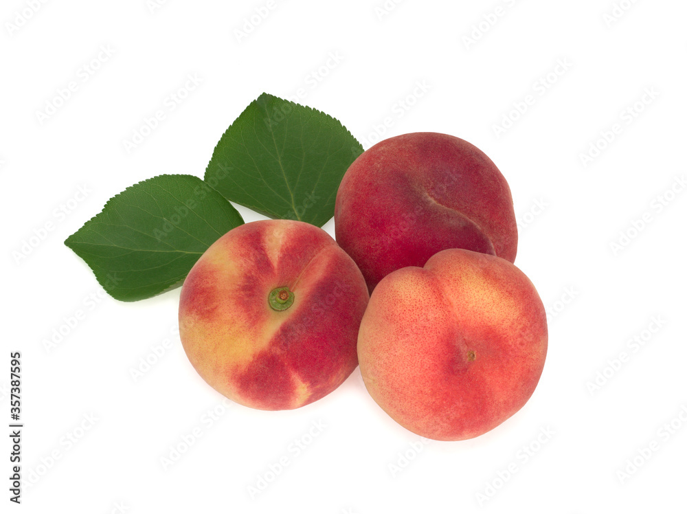 Three fig peaches with leaves isolated on white Three fig peaches with leaves isolated on white