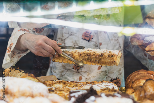 unrecognizable person holding a puff pastry