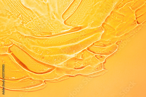 Cream gel yellow transparent cosmetic sample background photo