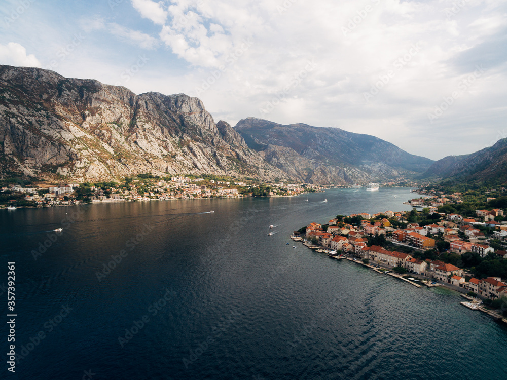 Kotor Bay, photo from a drone, near the city of Prchan. View of the town Dobrota and Kotor, and the rocky mountains above them.
