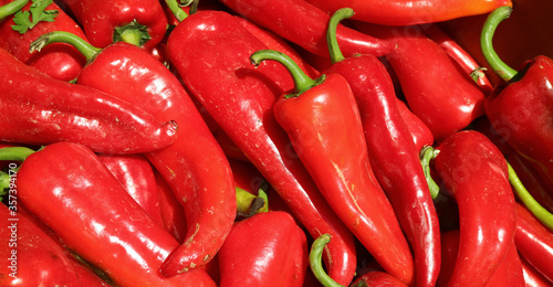 Pile of fresh ripe red chili peppers for sale at the local market