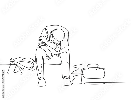 Single continuous line drawing of young depressed male manager bowed limply on chair after he got sacked from the work office. Job dismissal concept one line draw design graphic vector illustration