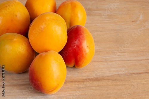 apricot berries on wooden background