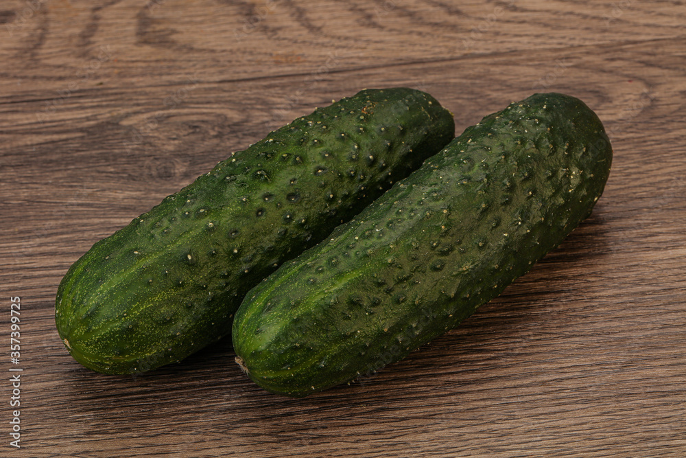 Green fresh cucumbers over background Green fresh cucumbers over background
