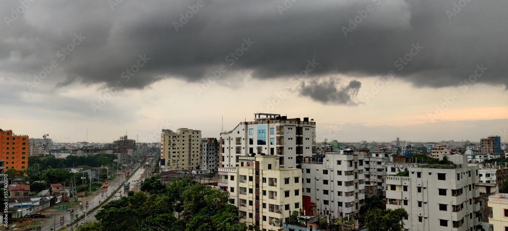 Fototapeta premium Dark sky and dramatic clouds before rainy. A cityscape before starting rain
