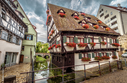 Crooked house or Hotel Schiefes Haus in Ulm, Germany. It is landmark of Ulm located in old Fisherman`s Quarter. photo