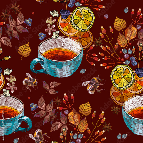 Embroidery cup of tea, bumble bee, carnation and wild berries. Autumn seamless pattern. Fashion autumn art. Template for design of clothes, tapestry. Fall garden art