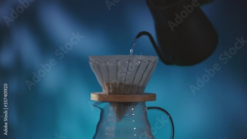 Coffee Drip Concept. Pouring Hot Water from Kettle into a Dripper. Making Hot Coffee Drink in House. Zen and Cozy Living