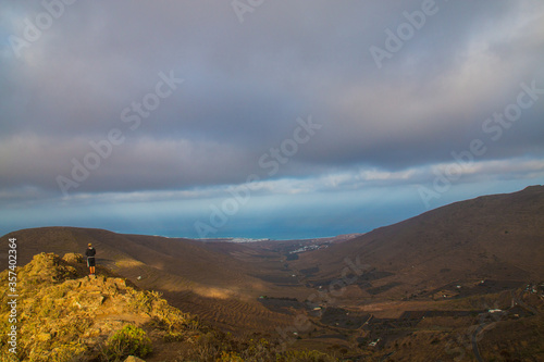 Scenic view of Wine-growing in La Geria on the island of Lanzarote.
vineyard upon black volcanic sand. Grape are from the volcanic are one of the main product in Lanzarote. Around the vineyard you can photo