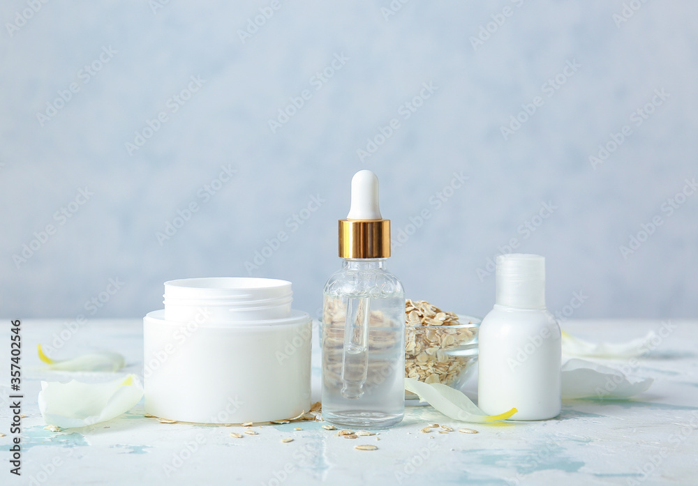 Natural cosmetics with ingredients on table