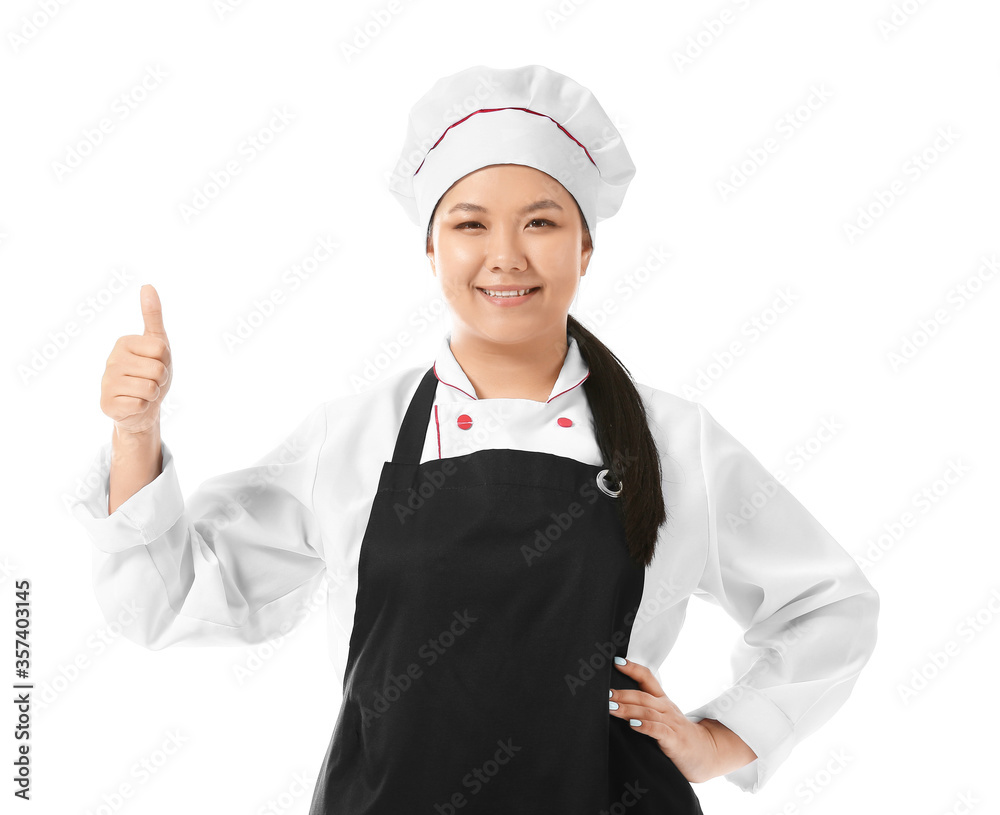 Beautiful Asian chef showing thumb-up gesture on white background Beautiful Asian chef showing thumb-up gesture on white background