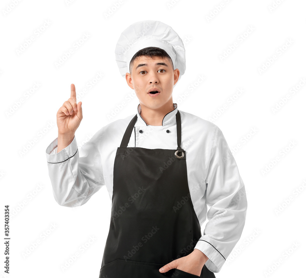 Handsome Asian chef with raised index finger on white background Handsome Asian chef with raised index finger on white background