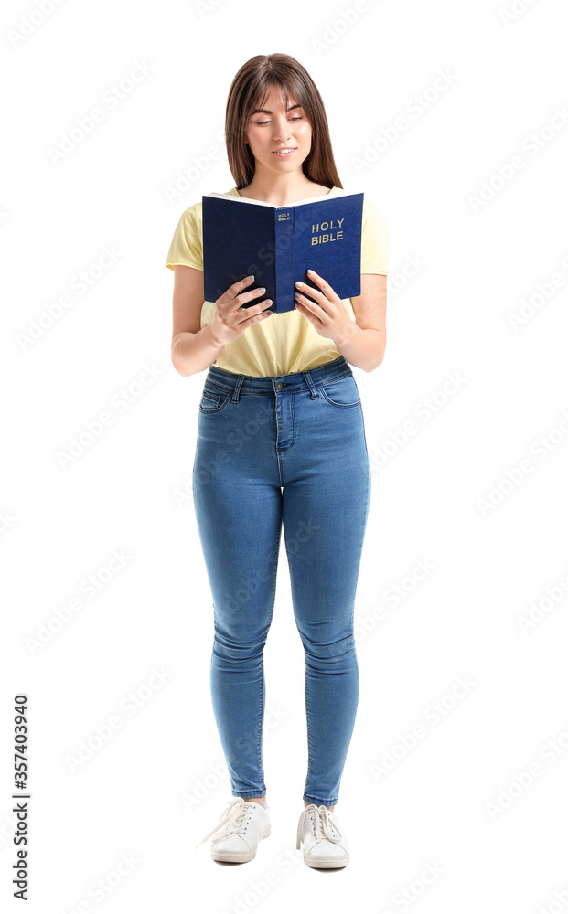 Young woman with Bible on white background Young woman with Bible on white background