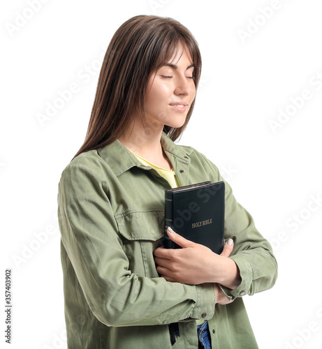 Young woman with Bible on w...