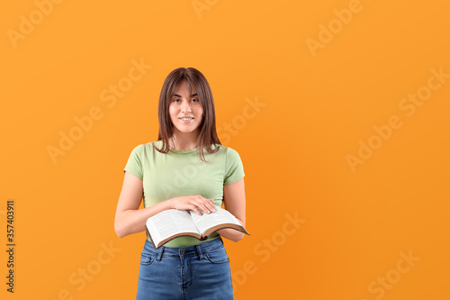 Young woman with Bible on c...