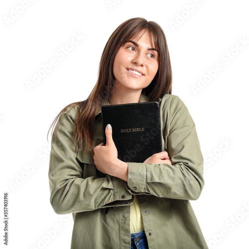 Young woman with Bible on w...