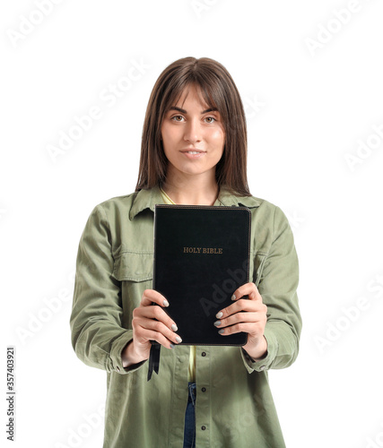 Young woman with Bible on w...