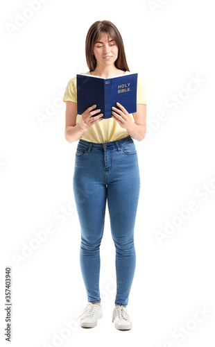 Young woman with Bible on w...
