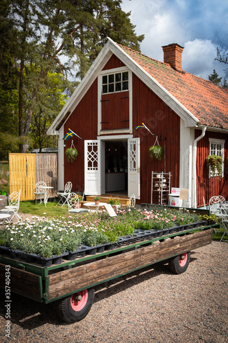 Swedish re cottage coffee with flowers for sale in the front. Bona tradgard Ostergotland Sweden photo