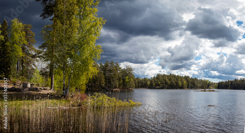 Panorama view of the lake at Karlsby Sweden Ostergotland. The lake Salstern. Dramatic clouds before the rain.