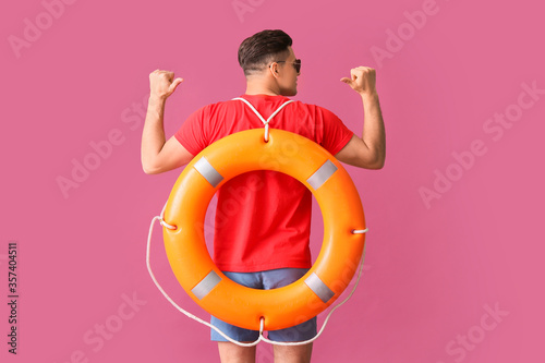 Beach rescuer with lifebuoy...