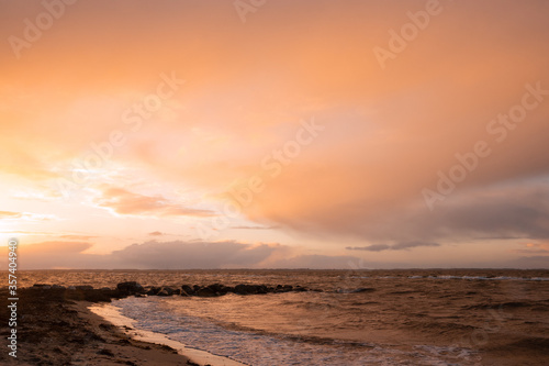 gorgeous sunset over the sea with red sky, seascape background 