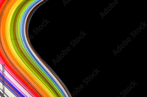 Abstract color wave curl rainbow strip paper on black background