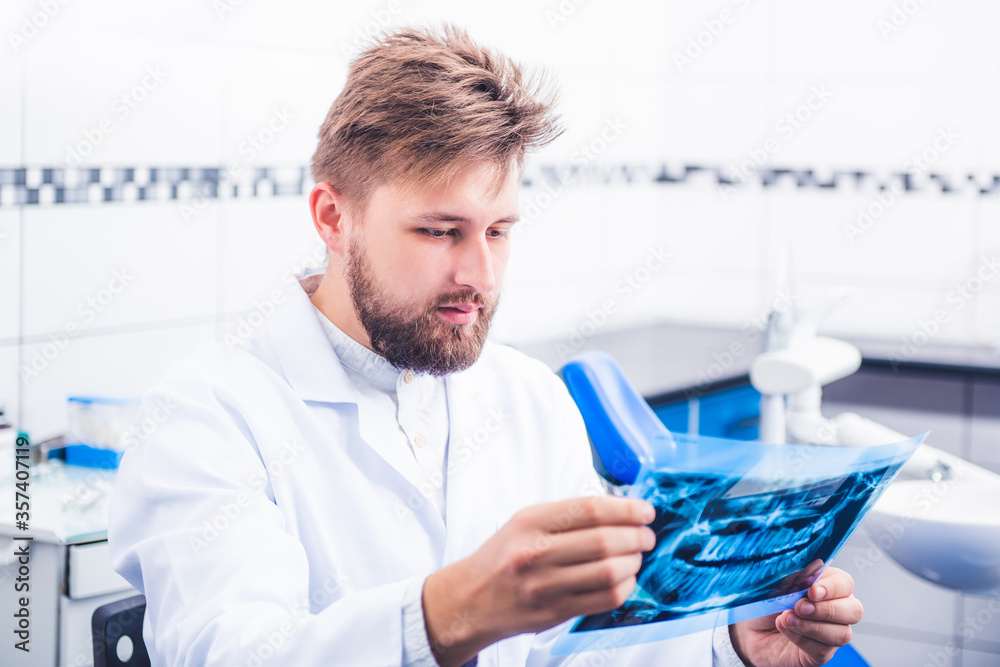 Doctor in uniform holding x-ray snapshot Doctor in uniform holding x-ray snapshot