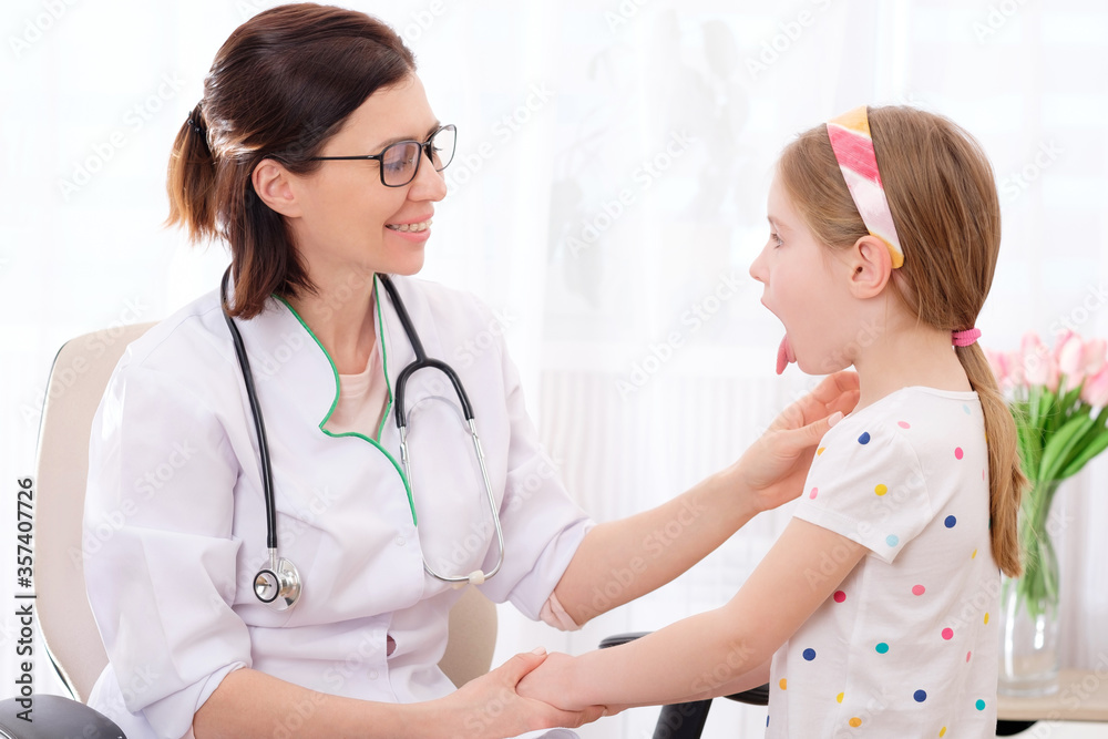 Doctor-physician checking pretty little girls glands Doctor-physician checking pretty little girls glands