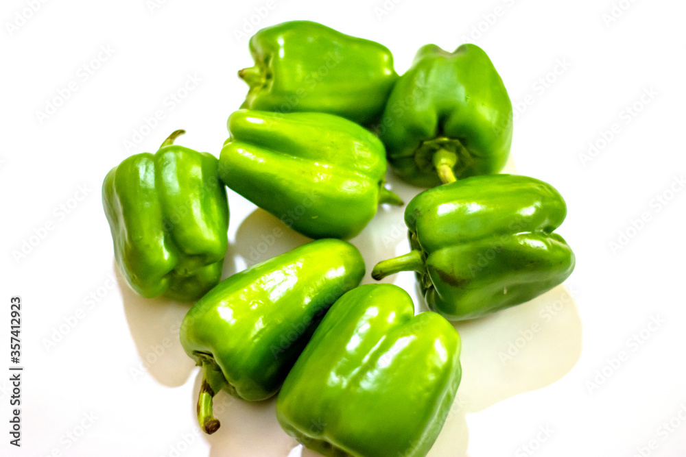 Fresh green capsicum or bell pepper isolated on a white background
Fresh green capsicum or bell pepper isolated on a white background