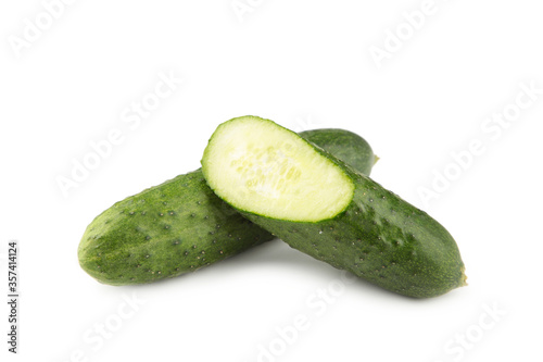 Fresh cucumber and slices isolated over white background.