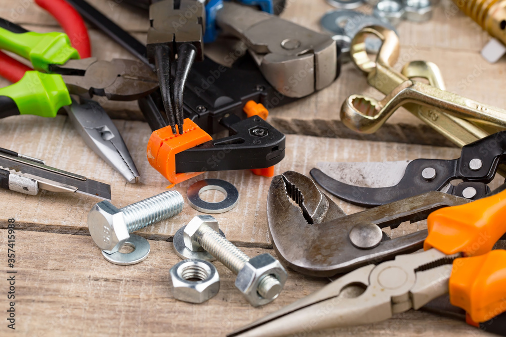 Fototapeta premium Different tools on the old background.