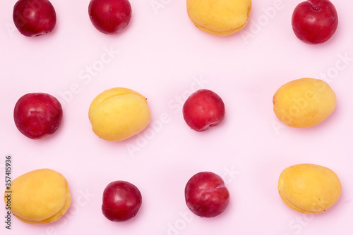 Tasty Fruits Apricots and Red Plums Summer Background Pink Background Top View Horizontal