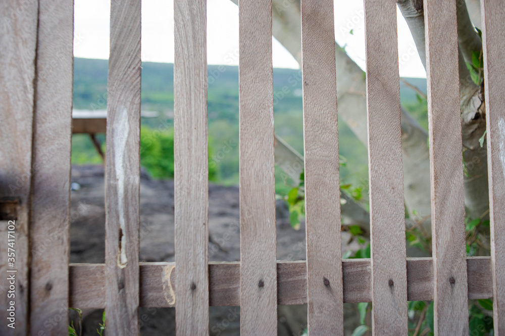 The balcony is made of old wood.