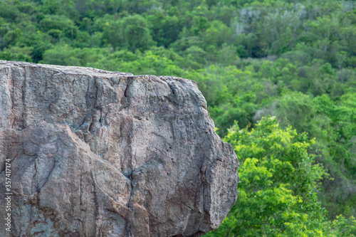 Large rock on the edge of a high cliff