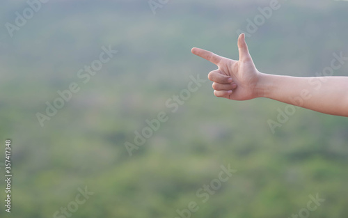 Someone is raising hand On a blurred background