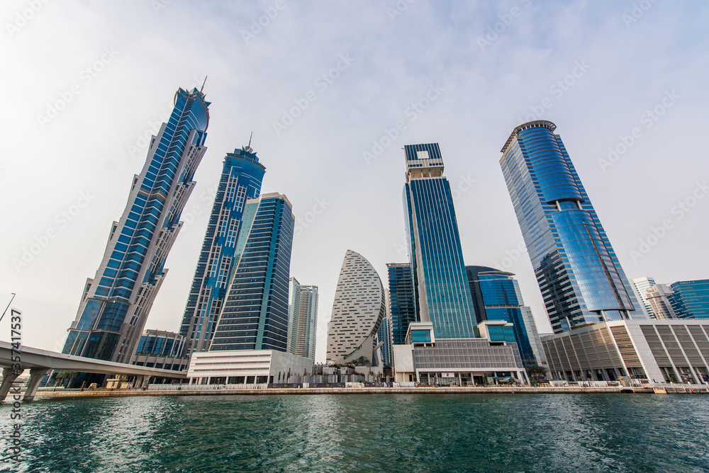 Obraz premium Modern skyscrapers in Dubai. Business bay district. View from water canal. Futuristic architecture.