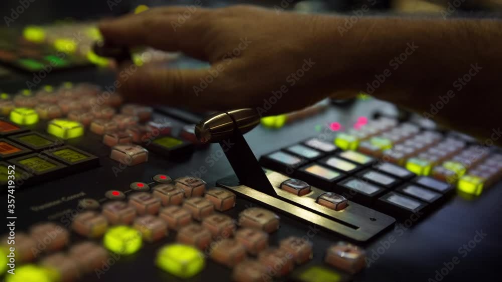 Broadcast Tv Studio Production - Vision Switcher 
Studio Director broadcast video mixer operation - Close-up of hand