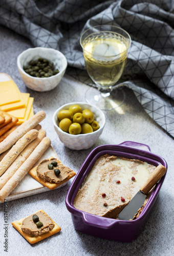 Chicken liver, onion and carrot paste, served with crackers, grissini, olives, capers and champagne.