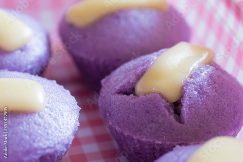 Ube puto with cheese. A Filipino style rice cupcake muffin with ube purple yam flavor.  photo