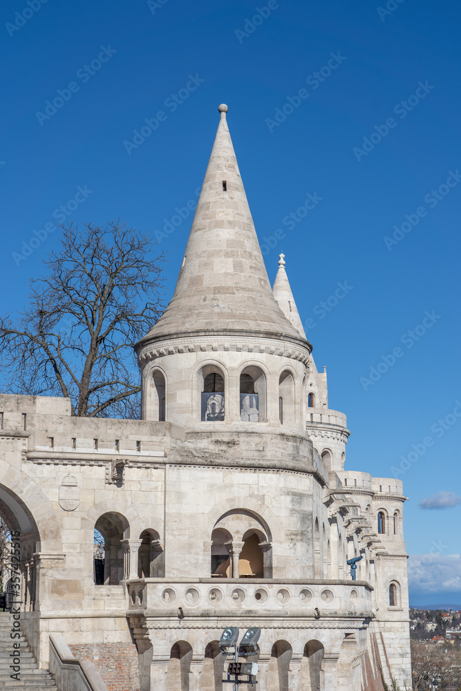 White high-pitched stone towers of Fisherman's Bastion on Buda castle in Budapest