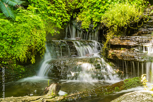 Waterfalls with cascading water levels In the midst of nature With green trees looking fresh
