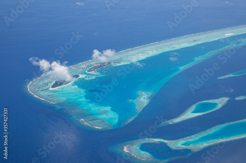 Aerial view of Maldives atolls is the world top beauty. Maldives tourism. Luxury travel destination, amazing nature environment, islands atoll and coral reef. Tropical landscape, aerial view