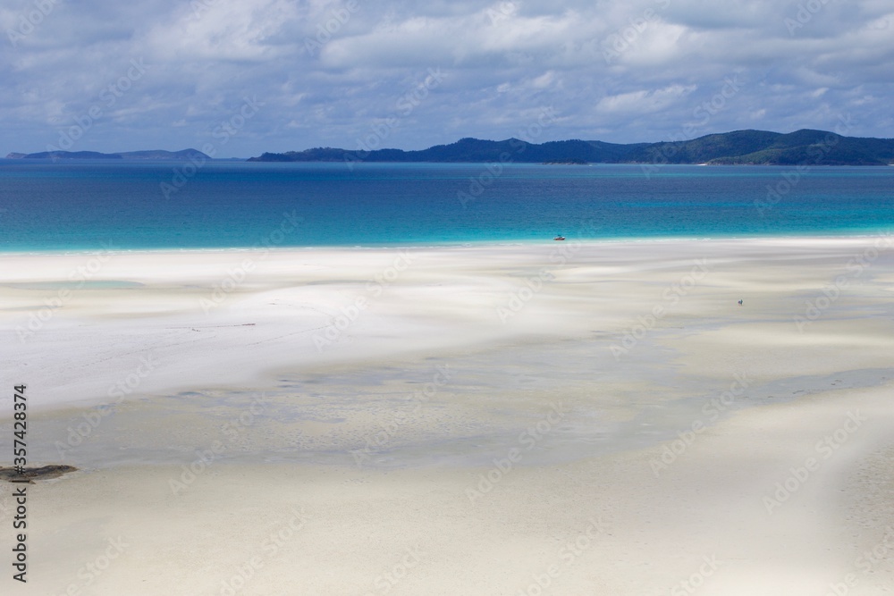 White sand beach and turquoise sea water, Whitsunday island, Australia 