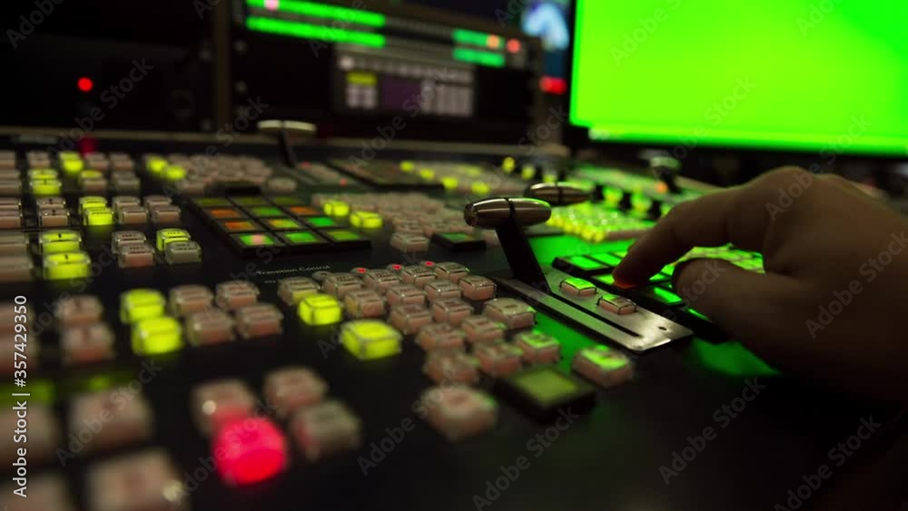 Broadcast Tv Studio Production - Vision Switcher 
Studio Director broadcast video mixer operation - Close-up of hand