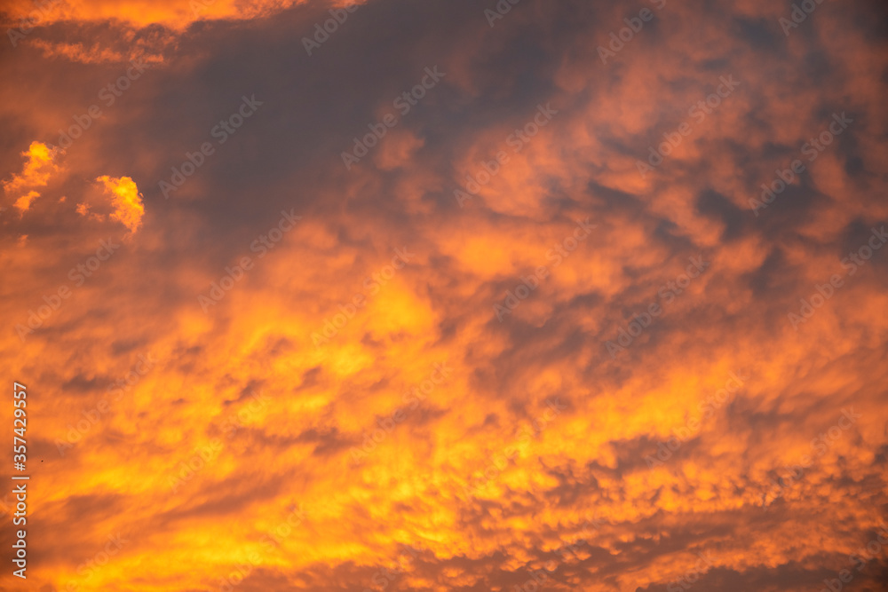 Beautiful bright sunset sky. Dramatic colorful clouds after sunset. Nature backgrounds.