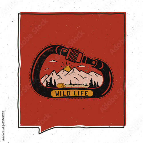 Vintage adventure badge illustration design. Outdoor emblem with carabiner, mountains and text - Wild life. Unusual hipster style patch. Stock vector