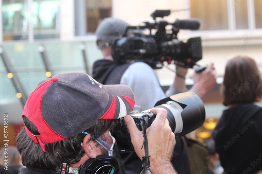 Sydney, NSW / Australia - June 6 2020: Black Lives Matter Protest March. Protesting Aboriginal deaths in custody and the death of. Photographer and video camera man recording the event Sydney, NSW / Australia - June 6 2020: Black Lives Matter Protest March. Protesting Aboriginal deaths in custody and the death of. Photographer and video camera man recording the event