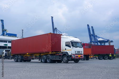 Container red truck in ship port Logistics.Transportation industry in port business 
