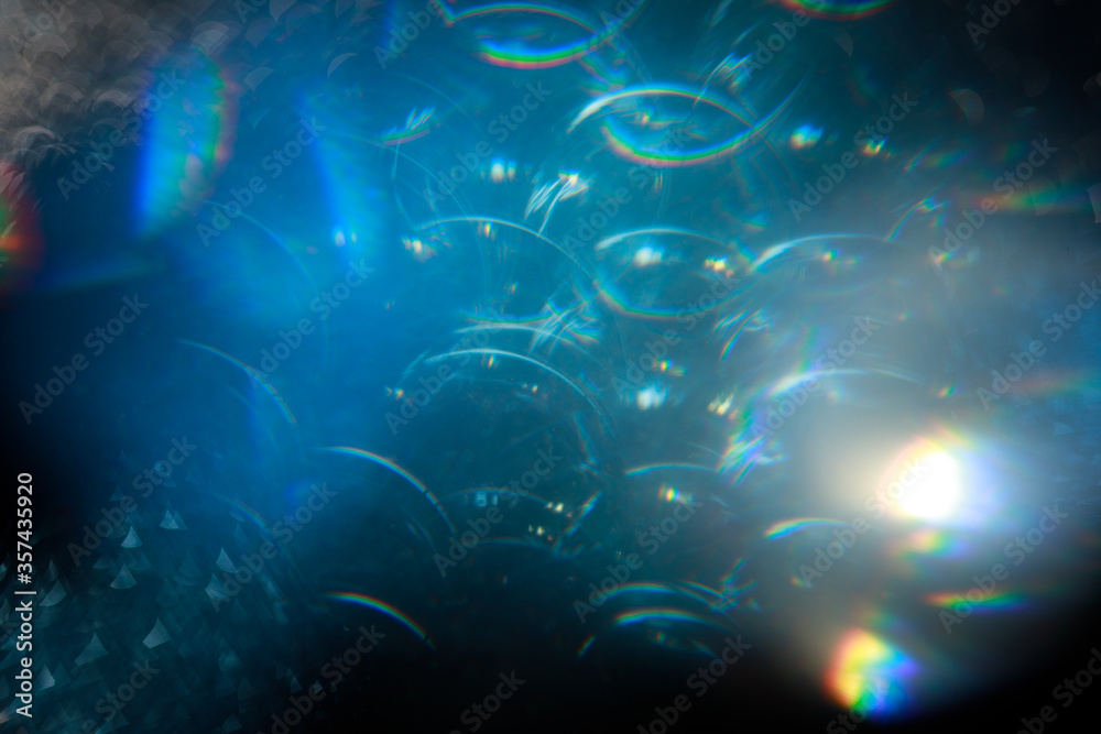 Easy to add lens flare effects for overlay designs or screen blending mode to make high-quality images. Abstract sun burst, digital flare, iridescent glare over black background.
